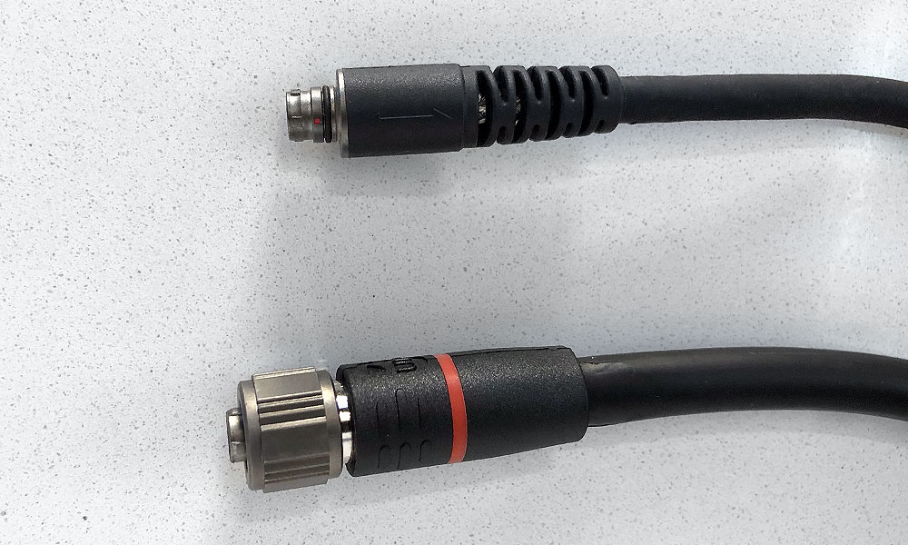 Top: Previous push-pull cable (same thickness as new 28 AWG cables)Bottom: New 26AWG cable (slightly thicker) with bayonet connector